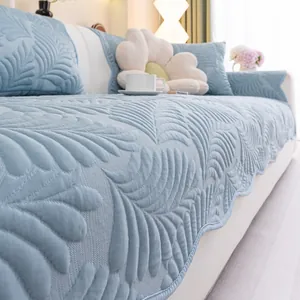 Detailed view of Morandi blue cooling silk sofa cover with feather quilted patterns