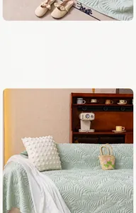 Detail of light green ice silk sofa mat with elegant leaf embossed texture and soft drape