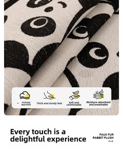 Macro shot of soft faux rabbit fur plush fabric with thick texture and black dot pattern