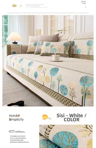 Détail du coussin de canapé nordique en coton avec motifs d'arbres et bords verts