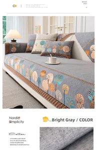 Détail de la housse de canapé en chenille grise nordique avec motifs d'arbres tissés