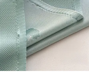Detailed close-up of light green cooling sofa cover fabric with reinforced stitching
