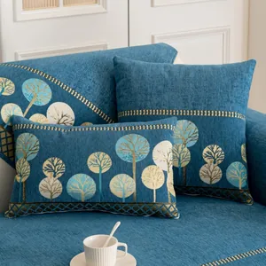 Coussins de canapé en chenille avec broderie d'arbre bleu et bords à texture géométrique
