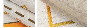 Vue détaillée de housse de canapé en chenille avec motifs géométriques et dos antidérapant