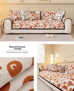 Macro detail of high gram weight orange chenille fabric with panda patterns on sofa cover