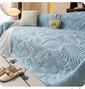 Detail of light blue sofa cover with premium 3D quilted feather texture and soft fabric