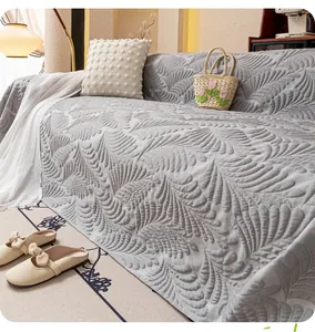 Detail of grey ice silk sofa cover with embossed feather texture for cooling protection