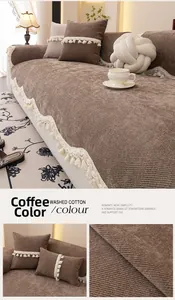 Detail of coffee brown washed cotton sofa cushion with tassel fringe and ribbed texture