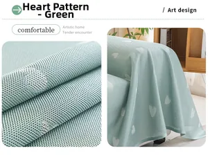 Close-up of green cooling sofa cover fabric with heart patterns and breathable mesh texture