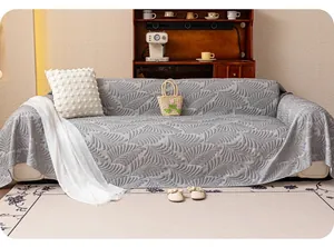 Close-up of gray ice silk sofa cover with 3D embossed leaf texture and draped design
