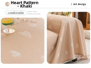 Detail of khaki heart-patterned cooling sofa cover with fine grid knit texture