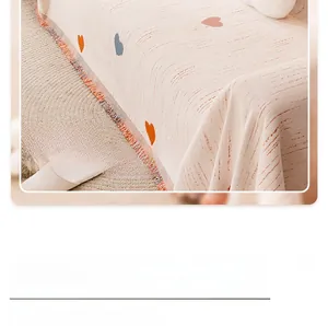 Detail of chenille sofa cover showing colorful heart patterns and fringe edges