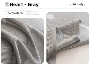 Detail view of grey summer cooling sofa cover with heart pattern and breathable grid texture
