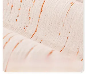 Macro shot of cream chenille sofa cover fabric with orange stripes and soft texture