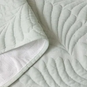 Summer ice silk sofa mat with quilted leaf pattern in soft mint green color