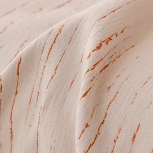 Modern cream chenille sofa cover with orange stripes and non-slip texture in macro view