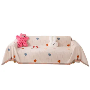 Cream chenille sofa cover with colorful heart patterns and fringed edges for home decor
