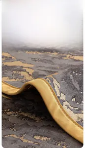 Gros plan sur la bordure dorée et la texture marbrée tissée en 3D de la housse de canapé