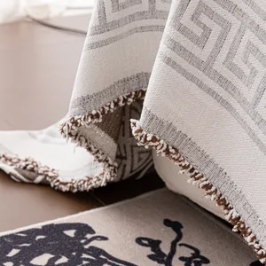 Minimalist beige Chinese style sofa throw with Greek key pattern and brown tassels