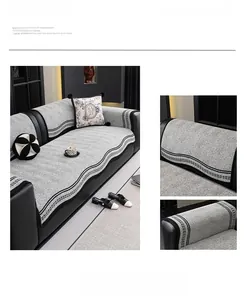 Detailed texture of gray chenille sofa cover with stylish geometric pattern trim