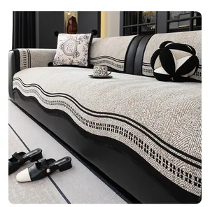 Detail of herringbone chenille sofa cover with wavy jacquard texture and thick fabric quality