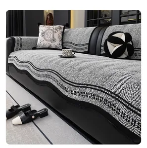 Detailed view of heavy knit chenille sofa cover with black and white herringbone pattern