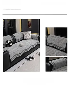 Detail of chenille sofa cover showing black and white geometric woven edge and fabric texture