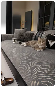 Detail of grey chenille sofa cover with water ripple pattern showing scratch resistance