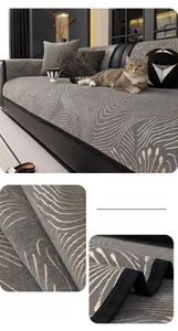 Detail of dark grey chenille sofa cover with wavy jacquard texture and black piped edges