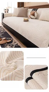 Detail of off-white chenille sofa cover with wave texture and black reinforced edges