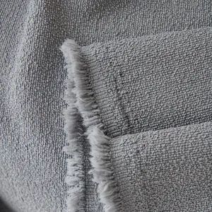 Waterproof teddy velvet sofa cover blanket in grey with elegant fringe details