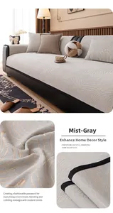 Close-up of light gray chenille sofa cover featuring golden wave jacquard and black piping