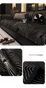 Detail of chenille sofa cover showing black abstract swirl texture and jacquard knit fabric