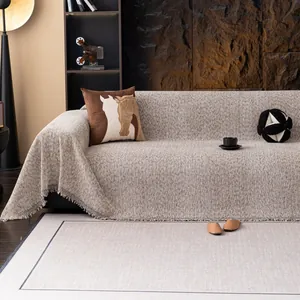 Housse de canapé beige effet lin avec texture tricotée épaisse et bordure à franges
