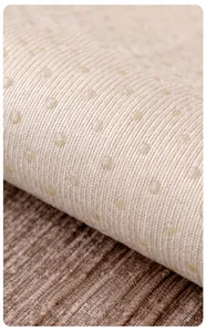 Detail of beige chenille sofa cover showing non-slip silicone backing for secure grip