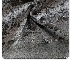Close-up of chenille sofa cover showing jacquard weave texture and metallic luster