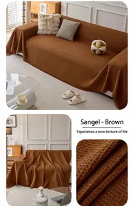 Detail of brown chenille waffle weave sofa cover featuring decorative fringe edges