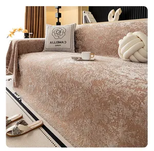 Close-up of pink chenille sofa cover showing jacquard texture and tassel details
