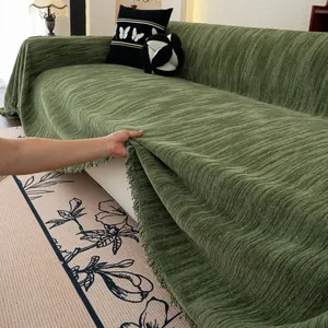 Deep green chenille sofa cover with vertical stripe texture and elegant tassels