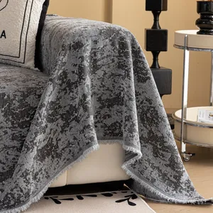 Grey chenille cream-style sofa cover with jacquard texture and elegant fringe tassels