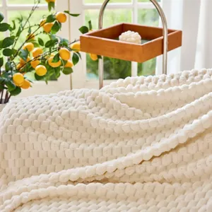 Soft cream plush sofa cover with 3D bubble texture for winter comfort and protection