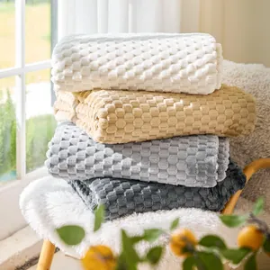 Thick non-slip waffle fleece sofa cover blankets in four colors on a wooden chair