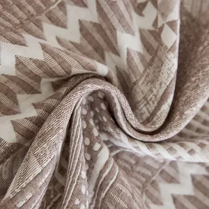 Creamy style washed cotton sofa blanket with geometric patterns and textured weave