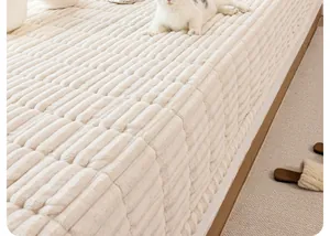 Detailed macro view of the cream-colored thickened plush texture on a cozy bay window mat