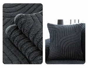 Macro shot of dark grey long plush cushion with embossed wave texture and soft fiber detail