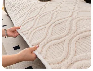 Detail of beige fleece sofa cover with 3D wave pattern and thick plush texture