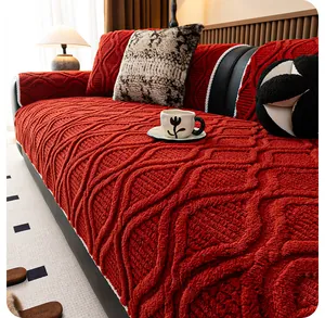 Detailed close-up of red jacquard plush sofa cover with 3D diamond texture patterns