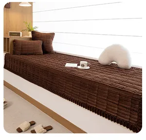 Detail of dark brown corduroy bay window mat with thick square quilted pattern texture