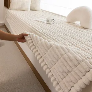 Creamy white plush bay window mat with thick striped texture and matching pillows