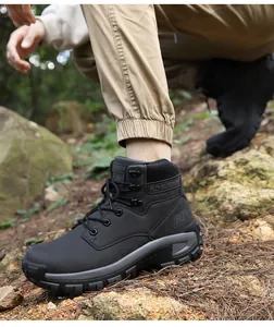 Detail of black tactical hiking boots featuring anti-slip rubber soles and metal eyelets